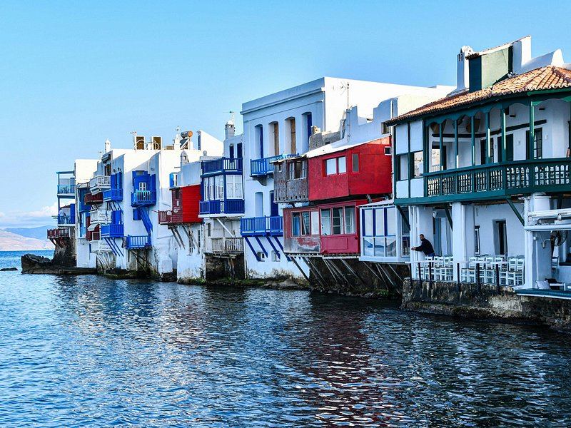 The painted balconies of Little Venice hanging directly over the water