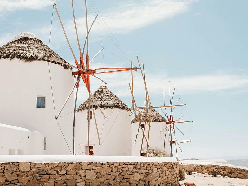 The bare northern headlands of Mykonos dropping to open sea