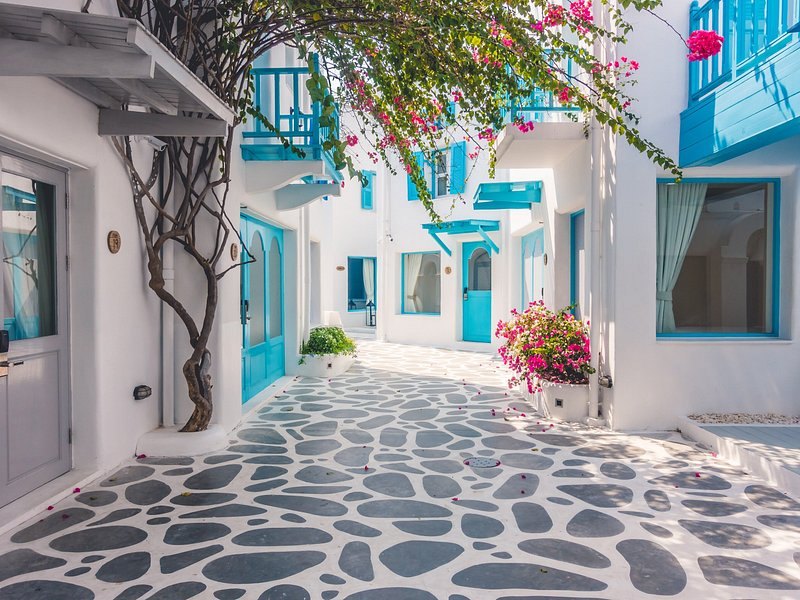 An empty whitewashed lane in the Chora before the day trippers arrive